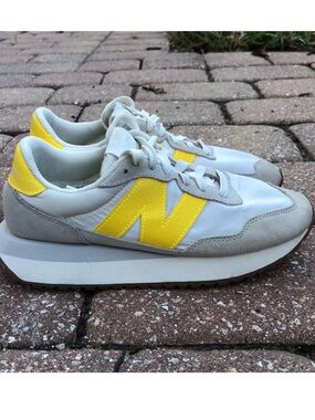 New Balance White Sneakers with Yellow 'N' Accent